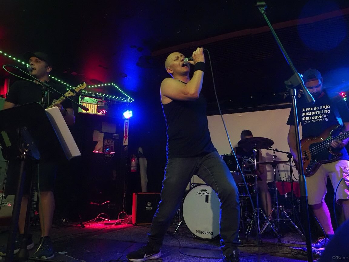 JBJ Band on stage with concert lighting